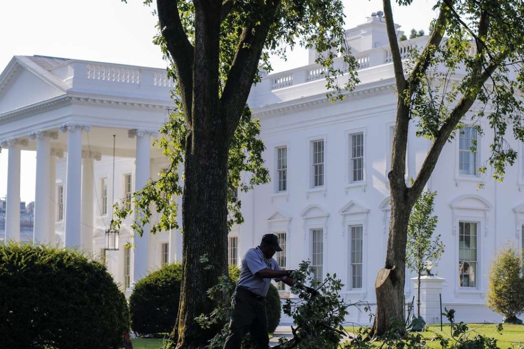 A worker in the grounds of the White House in Washington. Photo: EPA