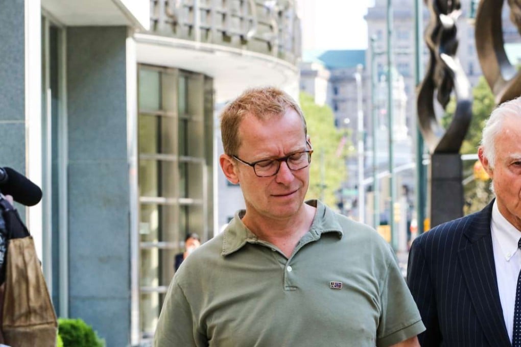 Mark Johnson, global head of foreign exchange cash trading in London HSBC Holdings Plc, center, leaves federal district court in the Brooklyn borough of New York after he was arrested for an alleged front-running scheme involving a US$3.5 billion currency transaction in 2011. Photo: Bloomberg