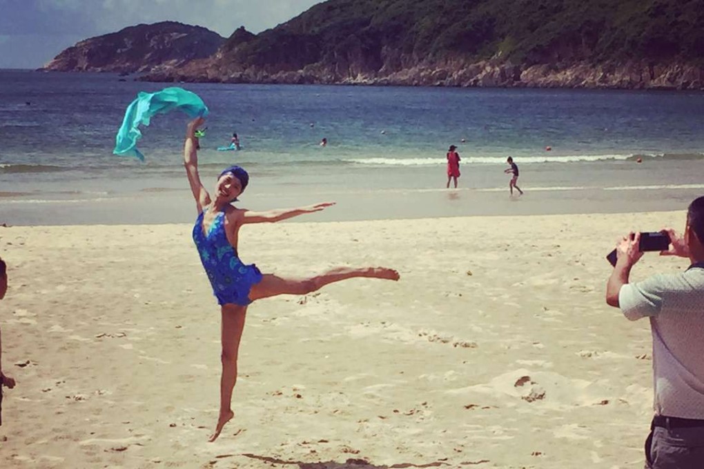 A woman poses for a picture at Big Wave Bay on a sweltering day. Photo: Yves Sieur