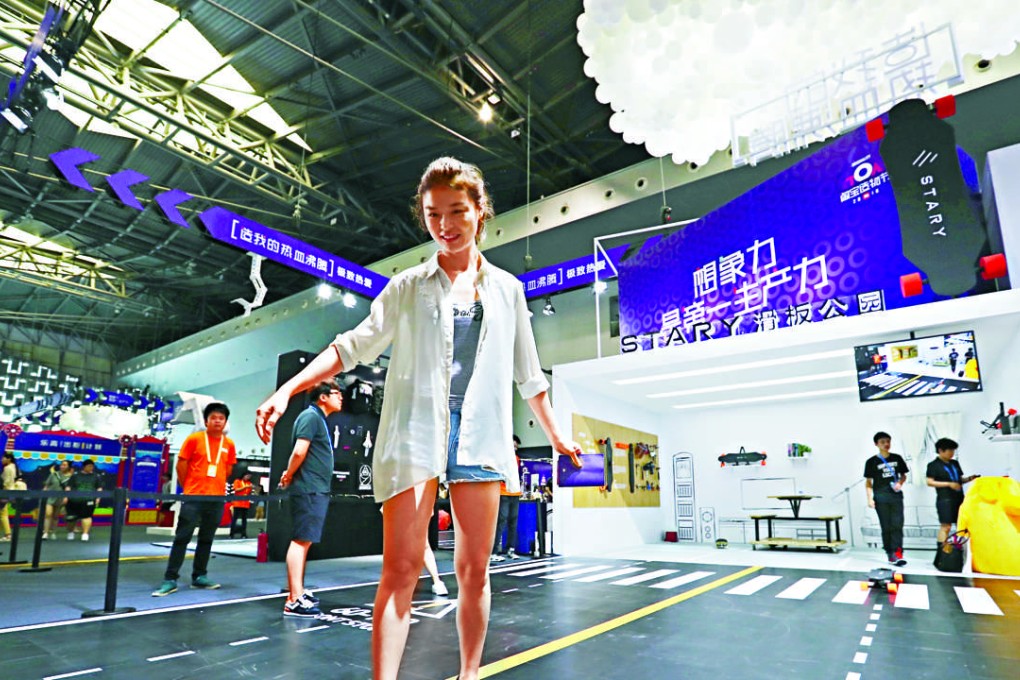 A woman tried an electric skate board made by a Taobao seller on the Taobao Maker Festival in Shanghai on Friday.