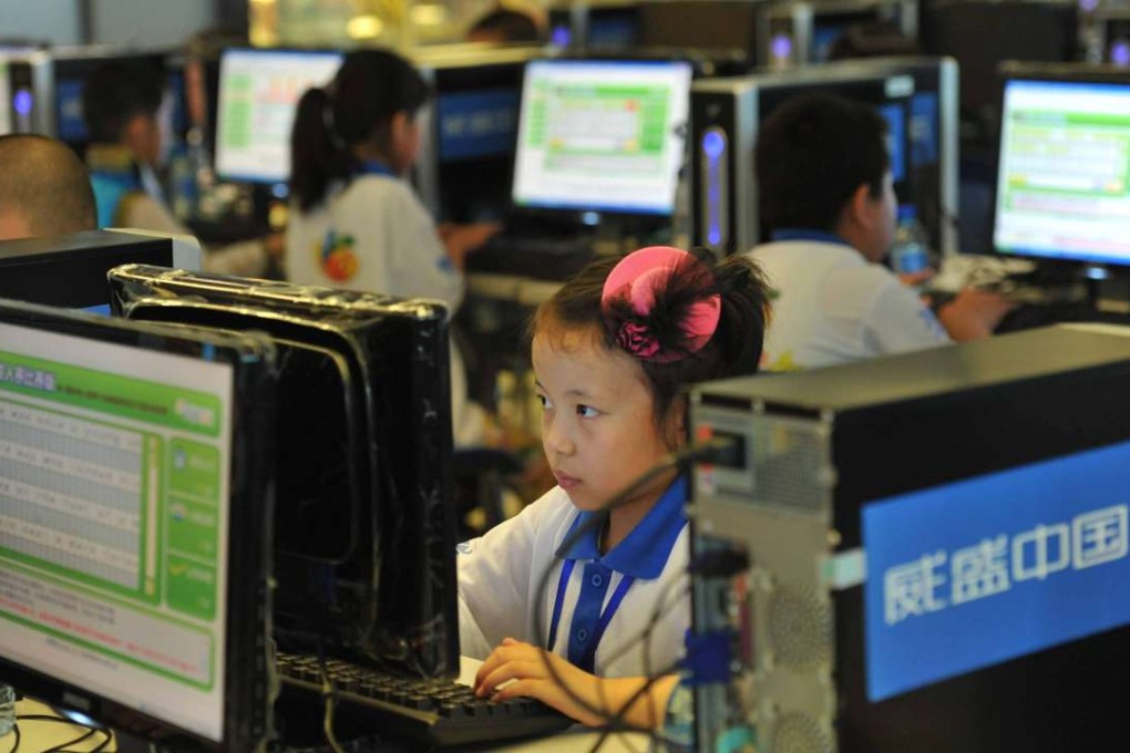 Children attend a computer class to learn how to properly use the internet in Beijing in the file photo from 2010. Photo: AFP