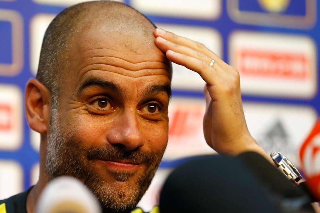 Pep Guardiola, manager of Manchester City gestures during the press conference for the match against Manchester United. Xinhua