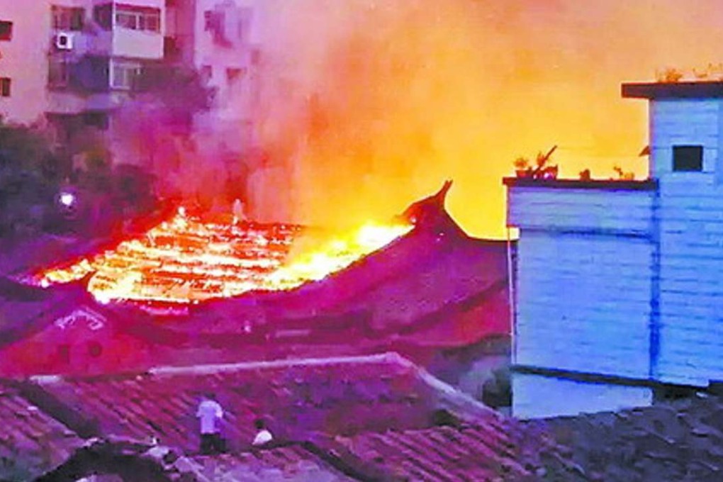 The fire started in the 300-year-old building in China’s Fujian province on Saturday evening. Photo: SCMP Pictures