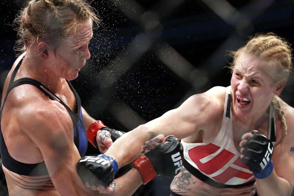 Valentina Shevchenko (right) follows through on a punch to Holly Holm. Photos: AP