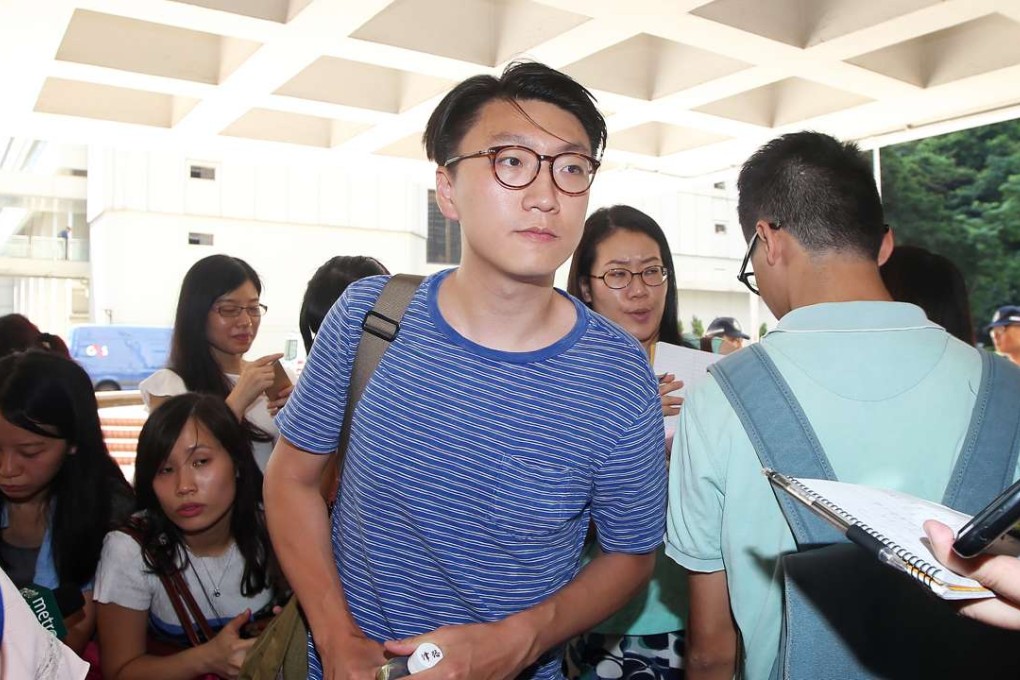 Radical localist activist Edward Leung (in blue) files a writ at the High Court. Photos: David Wong