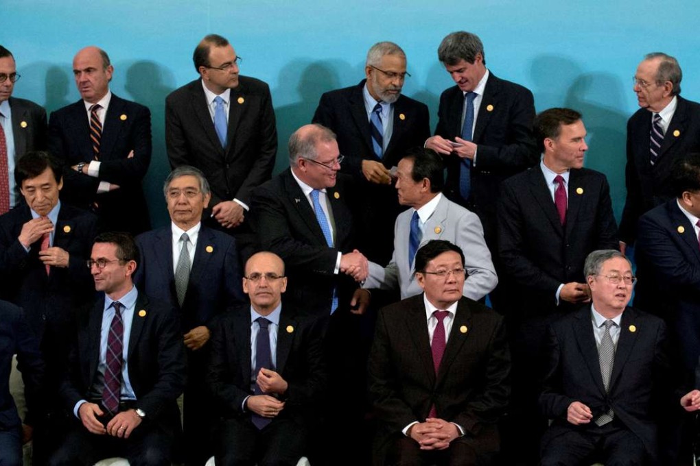 G20 finance ministers and central bank governors gather for a group photo on Sunday. Photo: Reuters