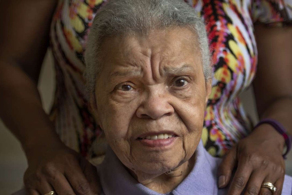 Loretta Veney (obscured) cares for her mother, Doris Woodward, who has dementia and lives in a group home in Fort Washington, Maryland. Photo: Washington Post