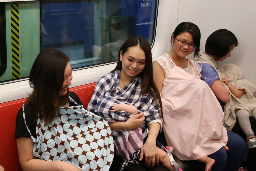 Mothers breastfeeding their babies during a flashmob event for the cause at Tai Wai MTR station. Photo: Sam Tsang