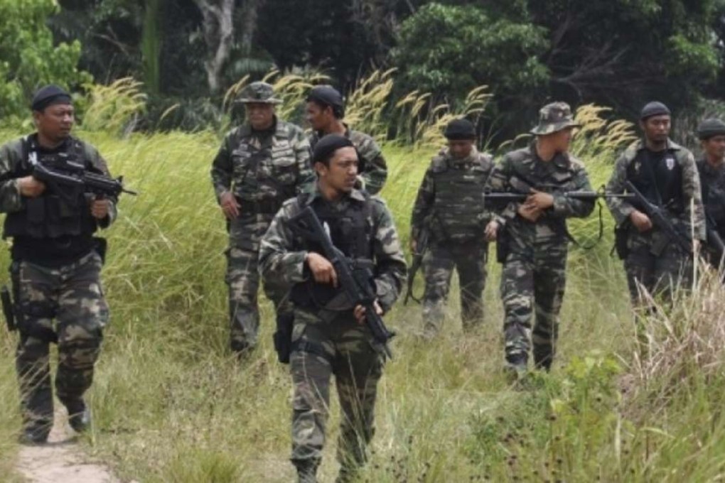 Malaysian soldiers patrol Sabah, Borneo, shortly after the incursion in 2013. Photo: EPA