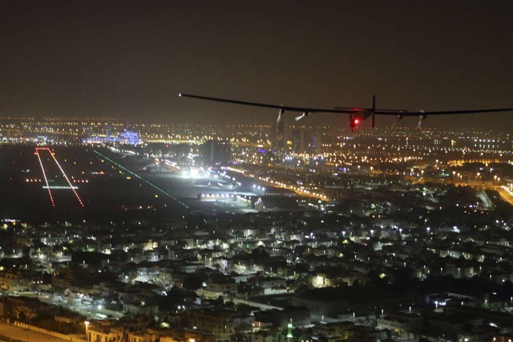 The Solar Impulse 2 plane approaches to land at Al Bateen Executive Airport in Abu Dhabi, United Arab Emirates, on Tuesday. Photo: AP