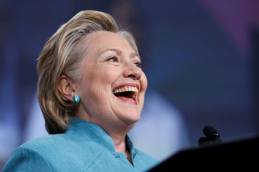 Hillary Clinton laughs as she is poised on Tuesday to become the first woman nominee of a major US political party to be its candidate for the White House. Photo: Reuters