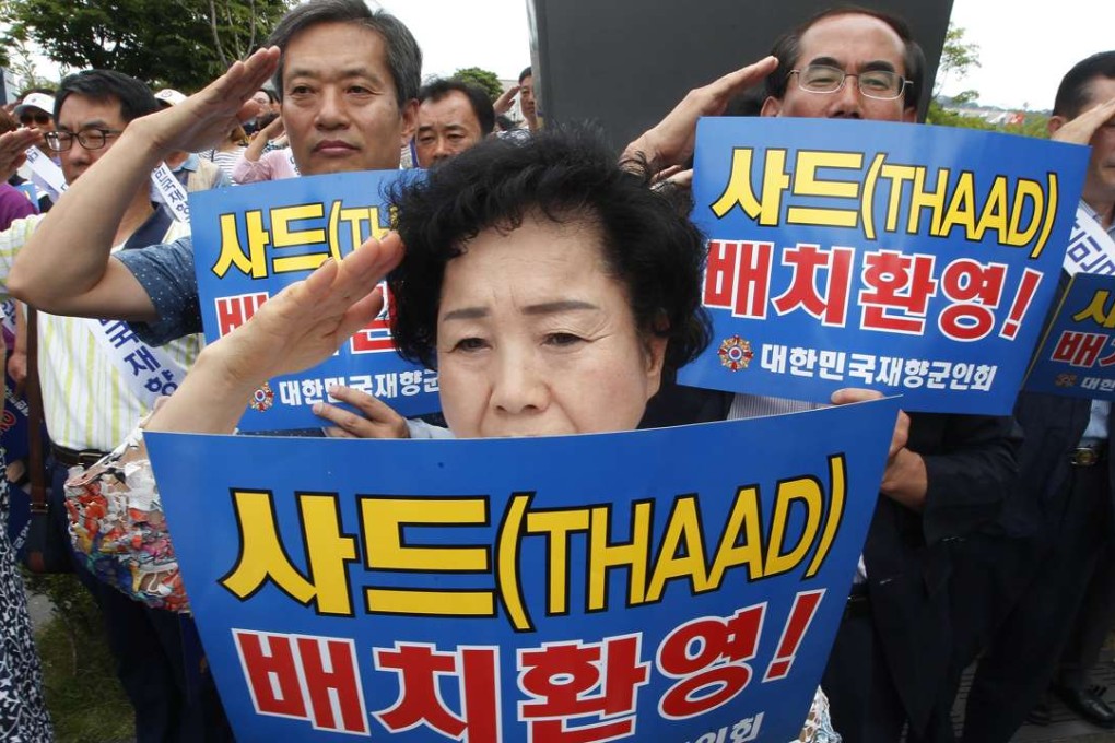 Members of the Korean Veterans Association salute during a rally in Seoul to support a deployment of Thaad. The advanced US missile defence system will be deployed in a rural town in southeast South Korea. Photo: AP
