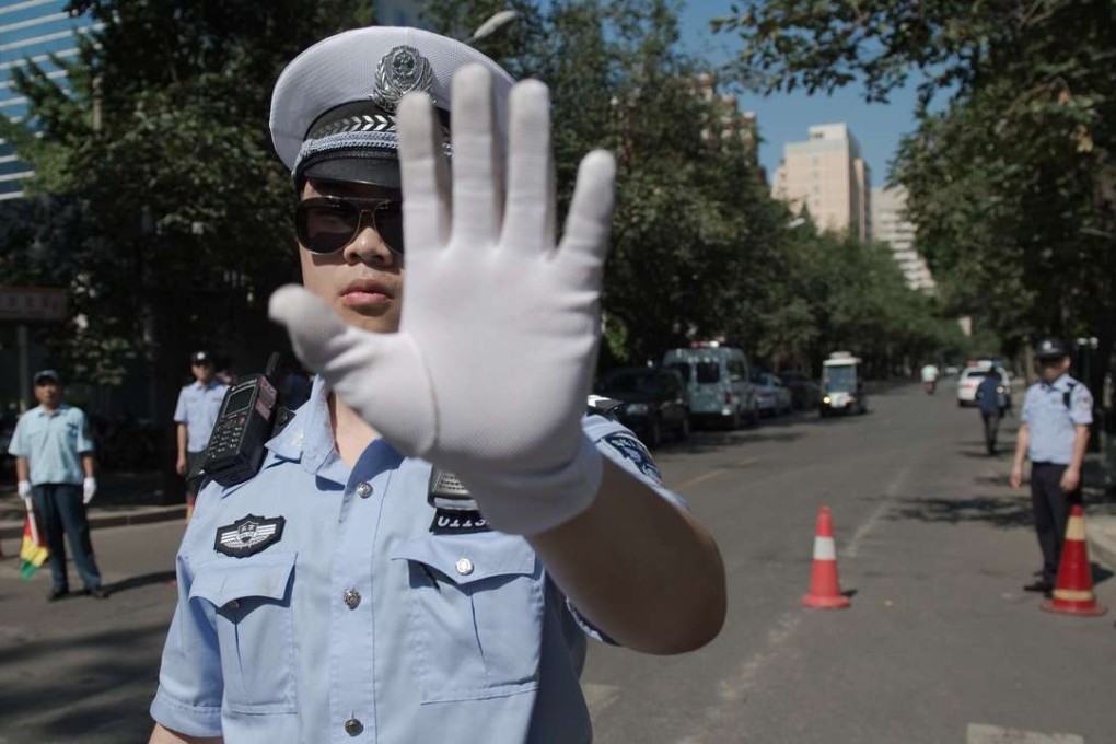 Chinese police officers at a roadblock in Beijing. Photo: AFP