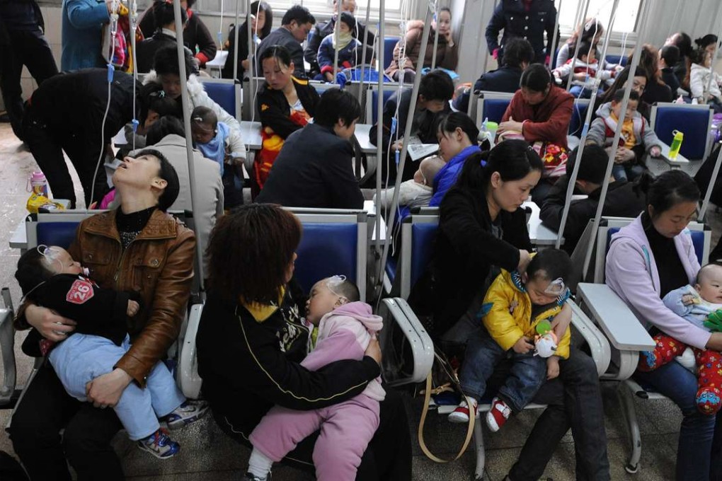 Families accompany their children as they get various injections from flu to rabies shots at a hospital in Hefei, Anhui province. Photo: AFP