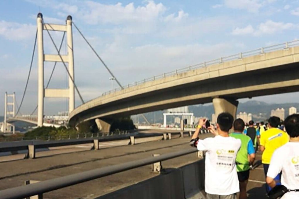 Many runners enjoy the scenery while crossing the Tsing Ma Bridge. Photos: SCMP Pictures