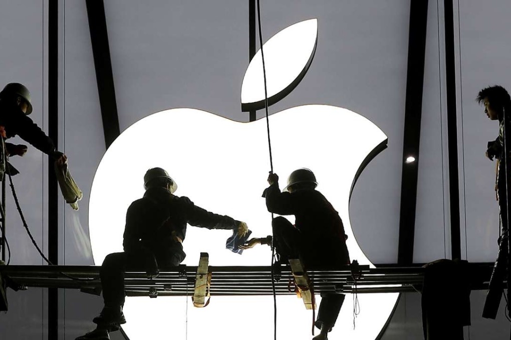 Workers prepare for the opening of an Apple store in Hangzhou, Zhejiang province in China. Photo: Reuters