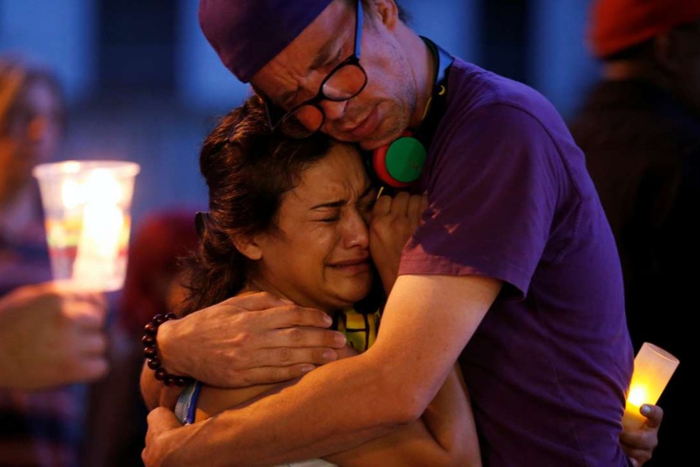 People embrace during a vigil for Abdirahman Abdi, a Somali immigrant to Canada who died after his arrest in Ottawa. Photo: Reuters