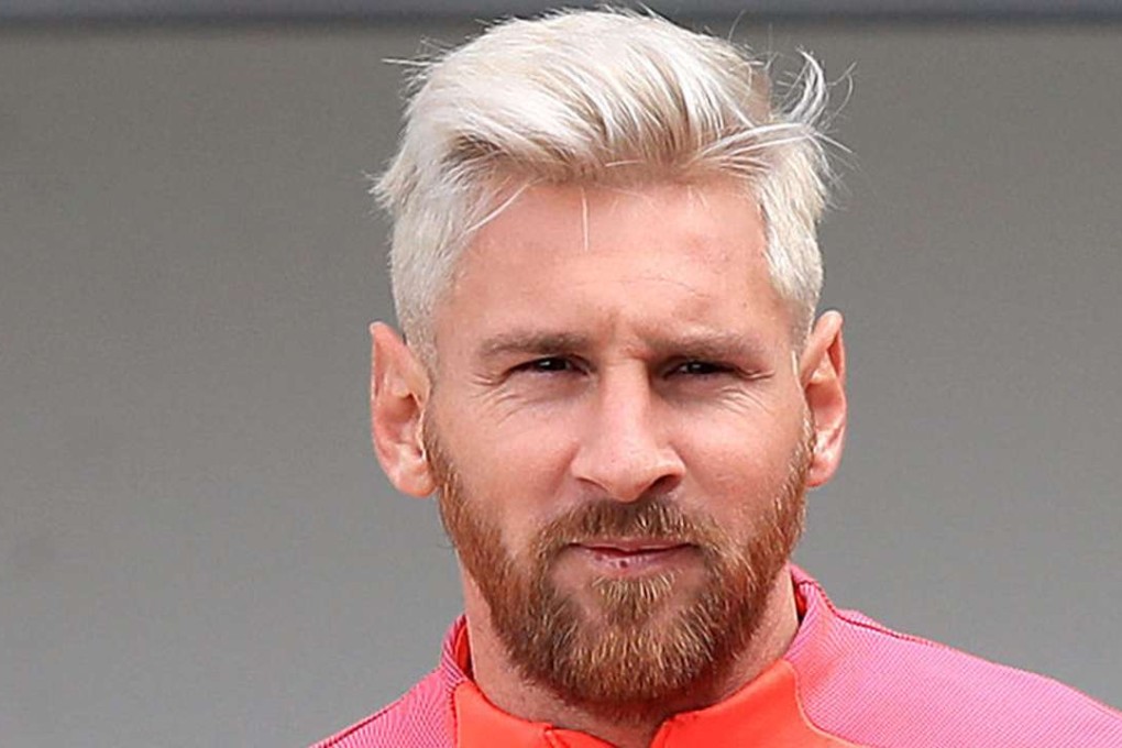 Lionel Messi sports his new blond hairdo at a training session. Photo: AP