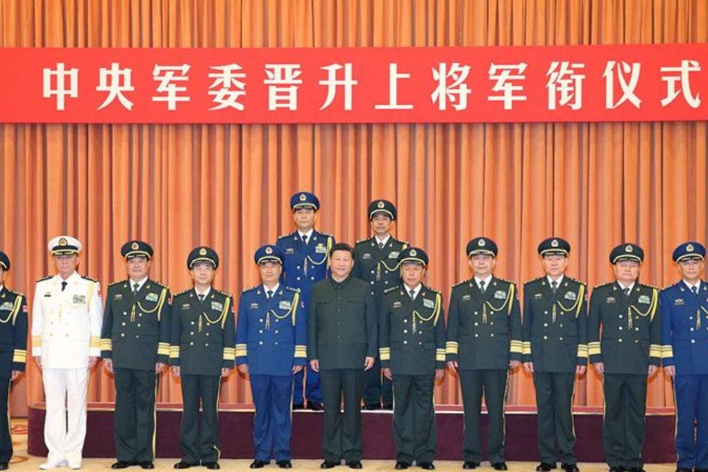 Yi Xiaoguang (back row, left) and Zhu Fuxi (back row, right) were promoted to general by President Xi Jinping (centre). Photo: PLA Daily