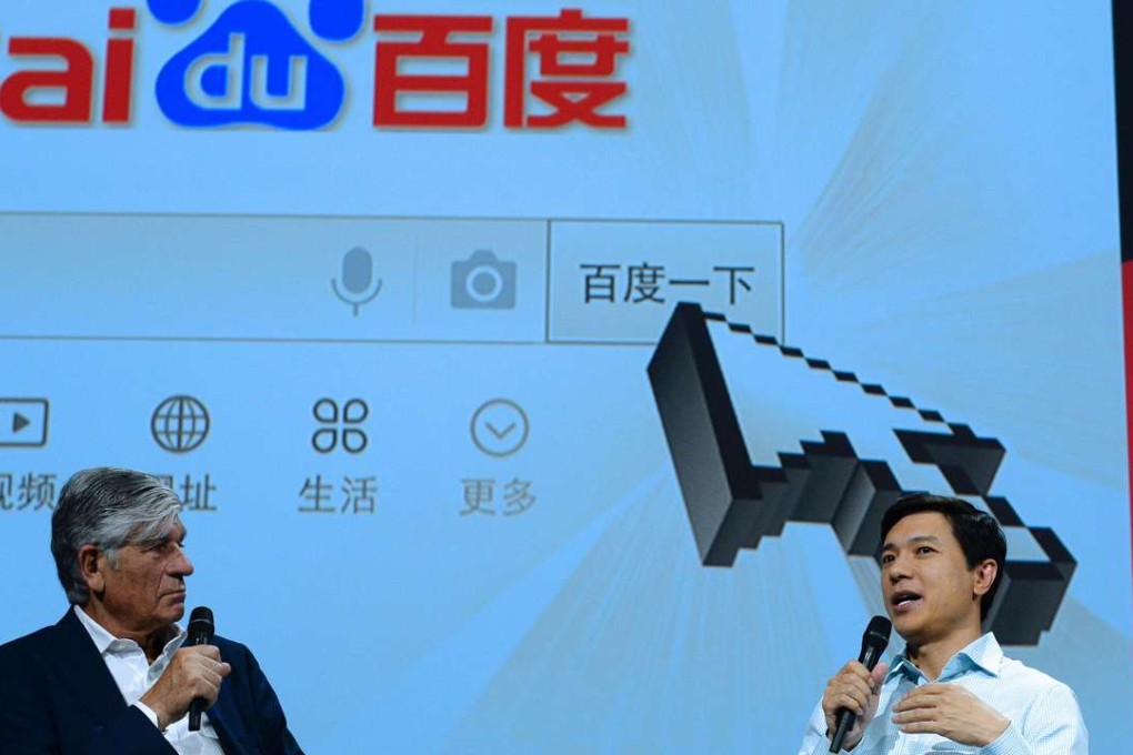 Robin Li (R), founder, Chairman and CEO of Baidu talks as Publicis Group Cairman and CEO Maurice Levy listens while attending a session at the Viva technology event in Paris. Photo: AFP