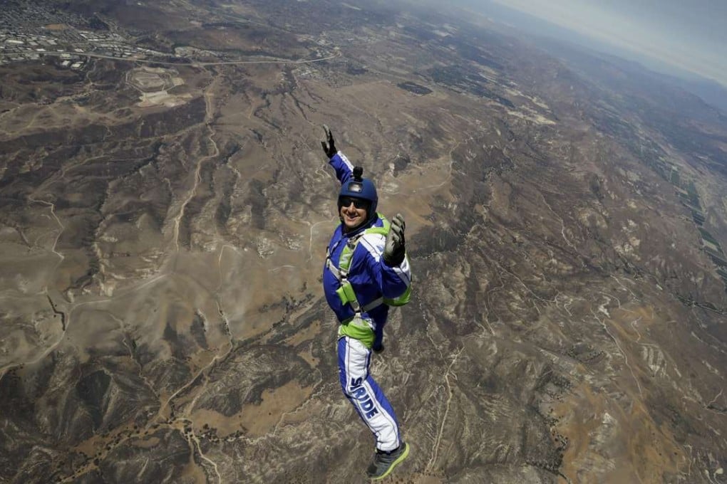 Skydiver Luke Aikins smiles as he jumps from a helicopter during training in Simi Valley, California, on MOnday. Photo: AP