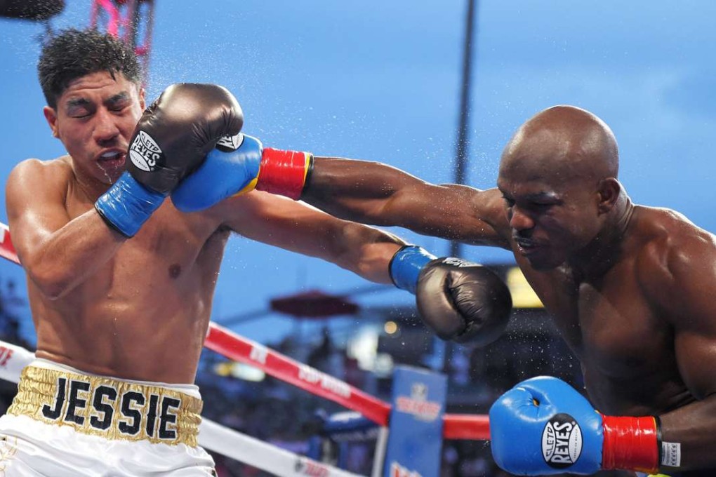 Timothy Bradley connects with Jessie Vargas during a welterweight bout for the interim WBO world title in June 2015. Photo: AP
