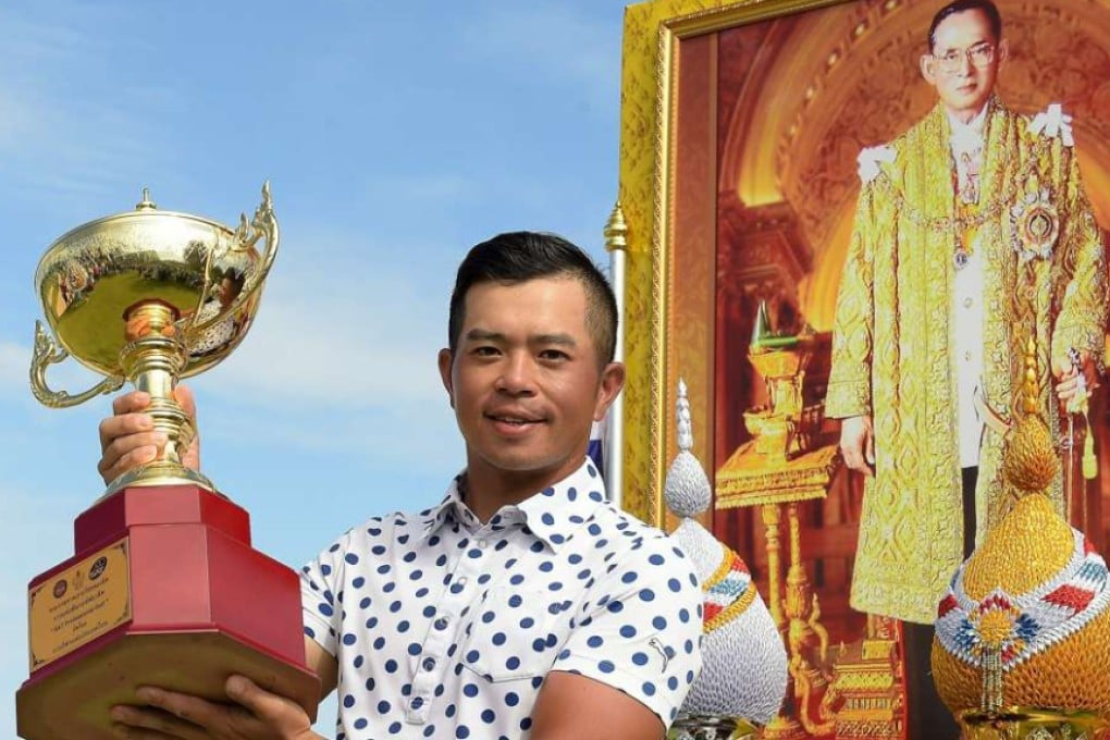 Chan Shih-chang of Taiwan holds up the winner's trophy after his victory in the King's Cup. Photo: AFP