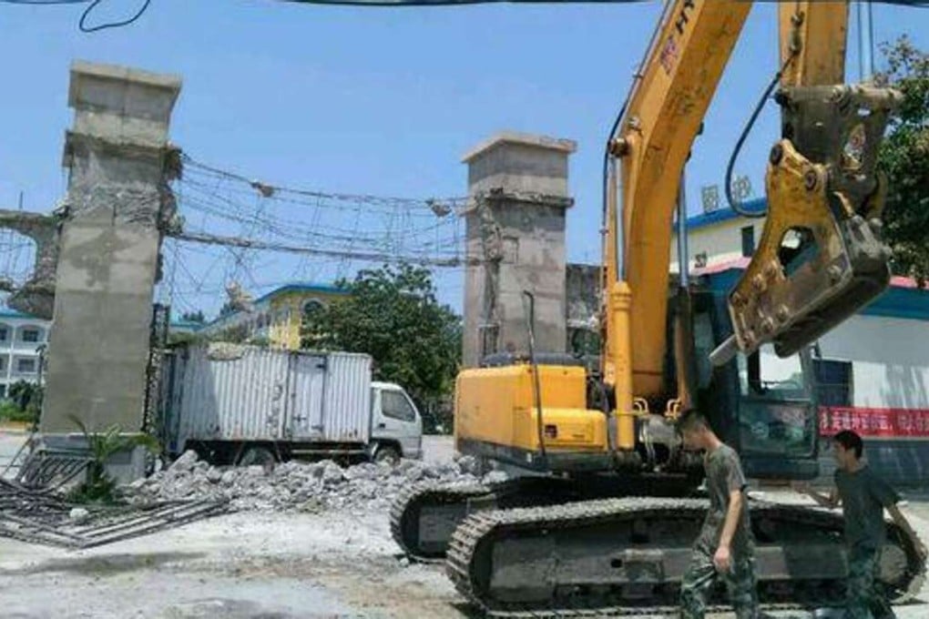 Violence erupted after a demolition crew tried to knock down structures at Zhengzhou Management Academy of Enterprises with Foreign Investment. Photo: SCMP Pictures