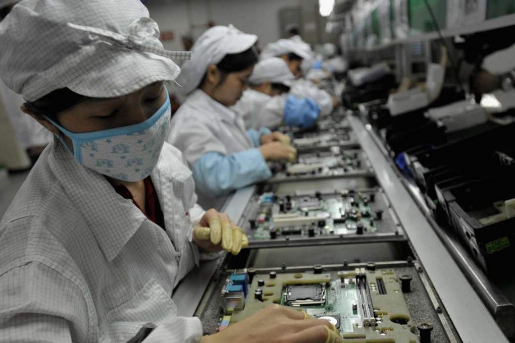 Foxconn management says the short life-cycle of electronic goods makes it more cost effective to use human workers throughout the manufacturing process. Photo: AFP