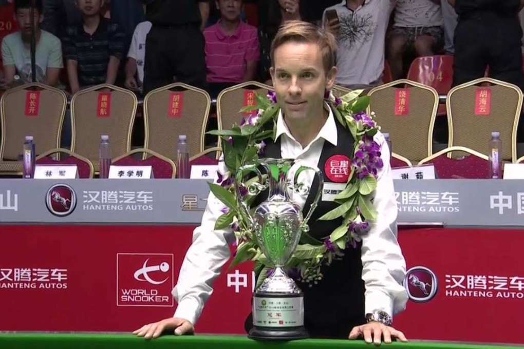 England’s Ali Carter celebrates his triumph over Joe Perry at the World Open.