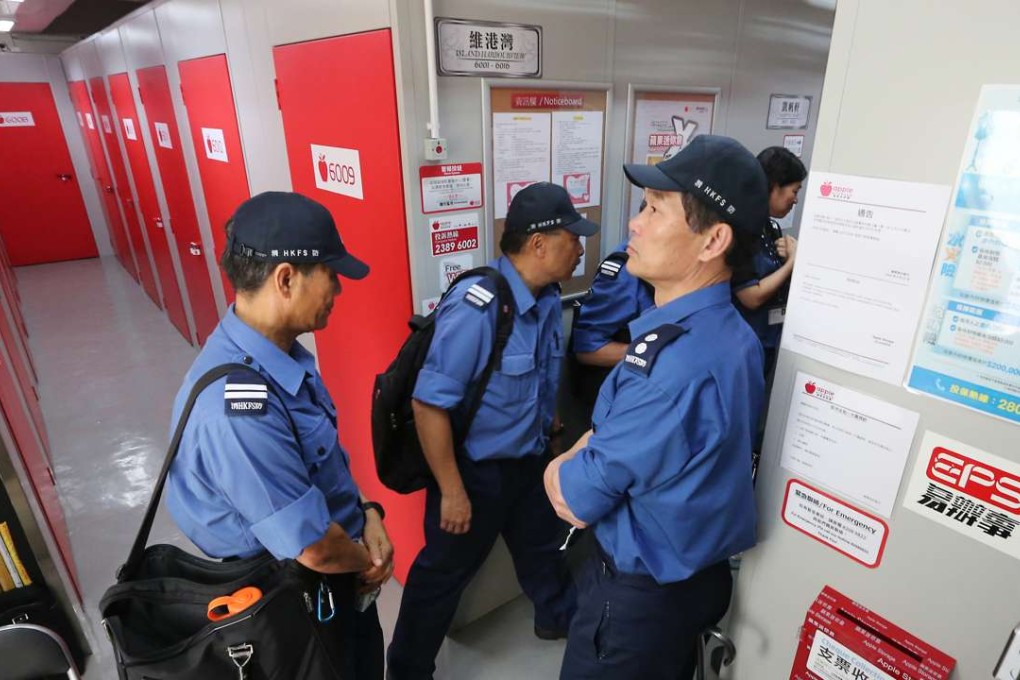 Firemen check fire protection system at a storage facility in Tai Kok Tsui. Photo: Felix Wong