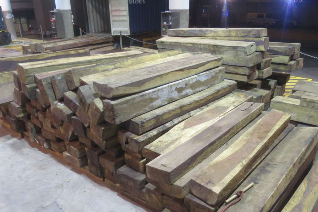 Hong Kong Customs seized about 73 tonnes of wood logs with a value of about HK$10 million from three containers on July 26 and 28. Photo: SCMP Pictures
