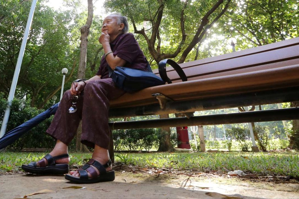 A old woman sit a bench in a park in Kennedy Town. Photo: SCMP