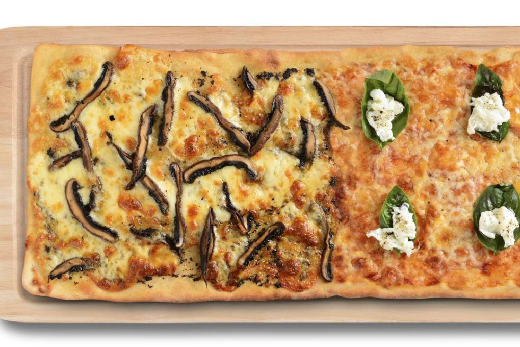 Half of the one-metre-long pizza at Sidewalk Café.