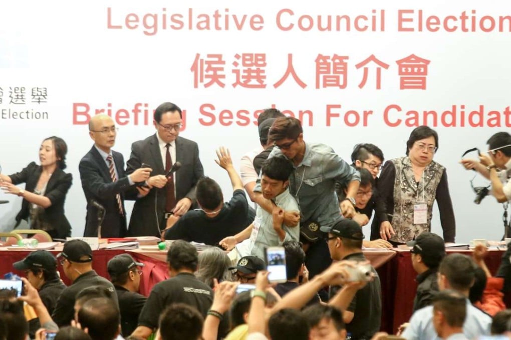 Pan democrats protest during 2016 Legislative Council General Election candidates' briefing at Kowloon Bay International Trade and Exhibition Centre. Photo: David Wong