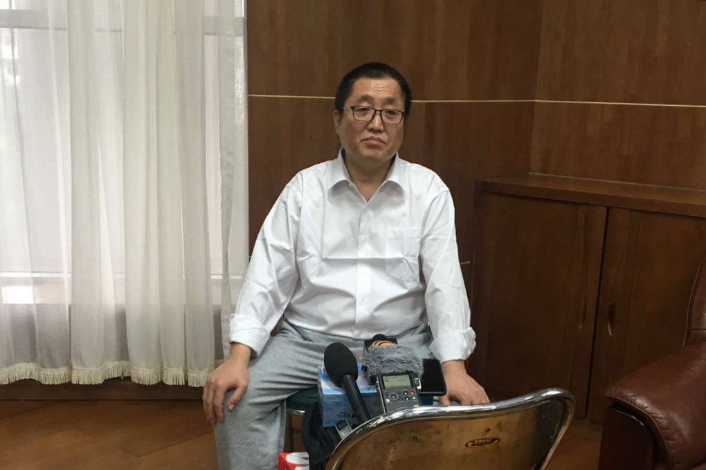 Zhai Yanmin speaks with reporters after his sentencing. Photo: Jun Mai