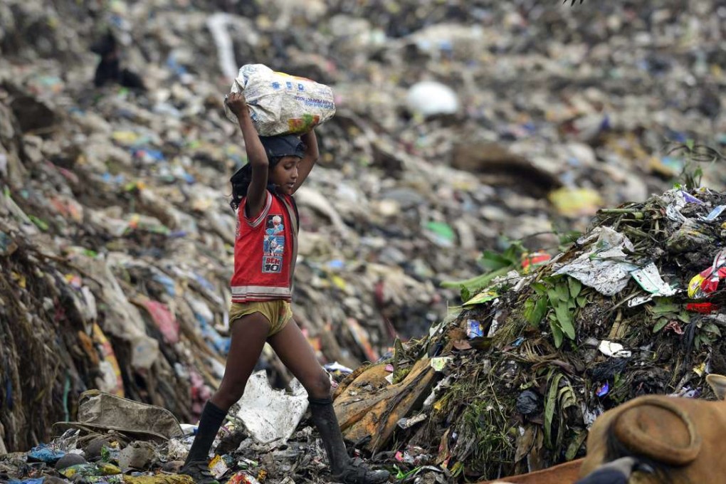 Allowing children to work in family-run businesses is likely to limit the chances of social mobility that come with education, as the child of a rag picker or potter would tend to end up in the same profession. Photo: EPA