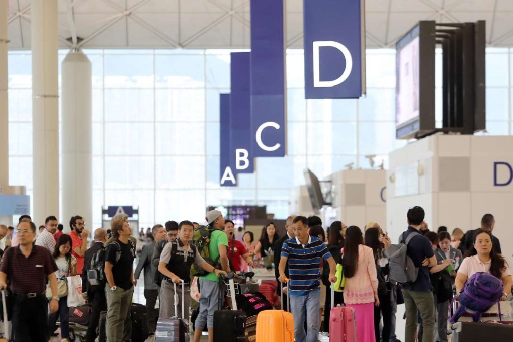 Travellers at the Hong Kong International Airport in Chek Lap Kok. Photo: SCMP Pictures