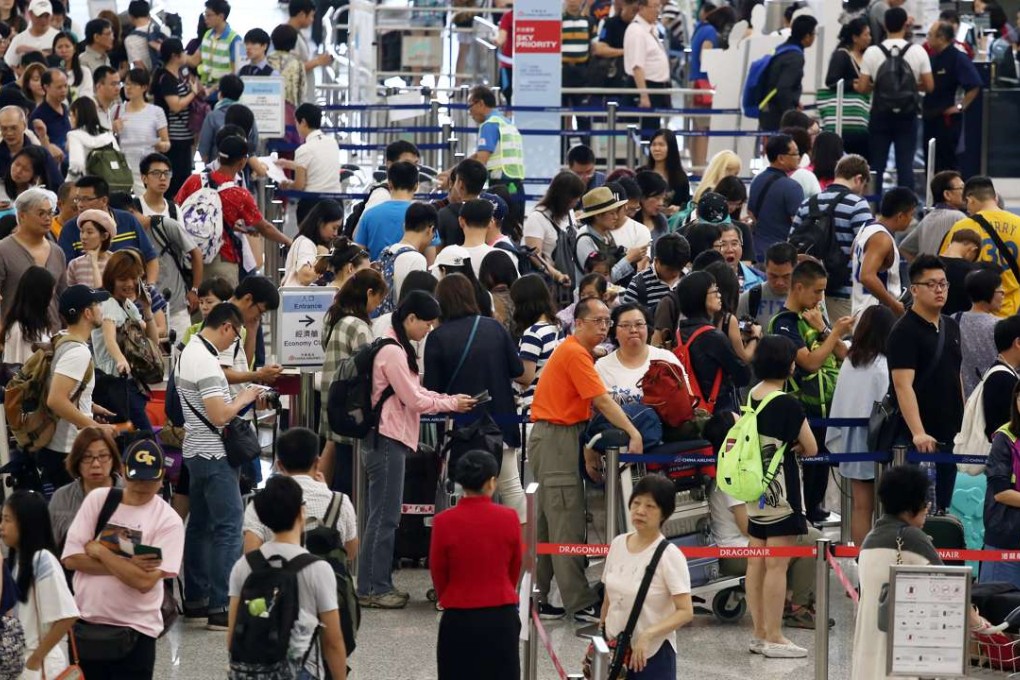 Travellers arriving at the Hong Kong International Airport in Chek Lap Kok after the typhoon signal No 8 was cancelled as Typhoon Nida moved northwest across southern China. 02AUG16 SCMP/Photo: Jonathan Wong