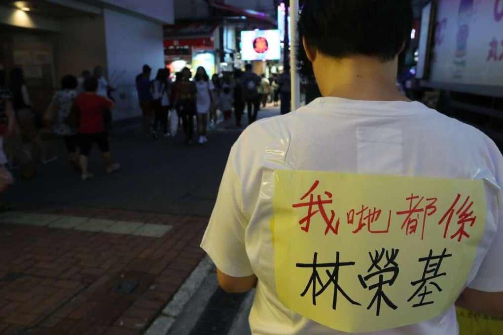 A member of Hong Kong’s Labour Party protests near Causeway Bay Books to support Lam Wing-kee, one of the five booksellers detained on the mainland. The sign he wears says “We’re all Lam Wing-kee”. Photo: Edward Wong