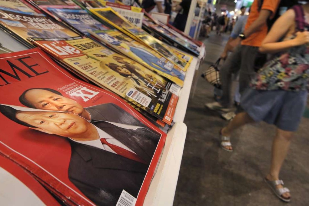 An April 2016 issue of Time magazine that features portraits of Xi Jinping and Mao Zedong on its cover is displayed at the Hong Kong Book Fair last month. Photo: AP