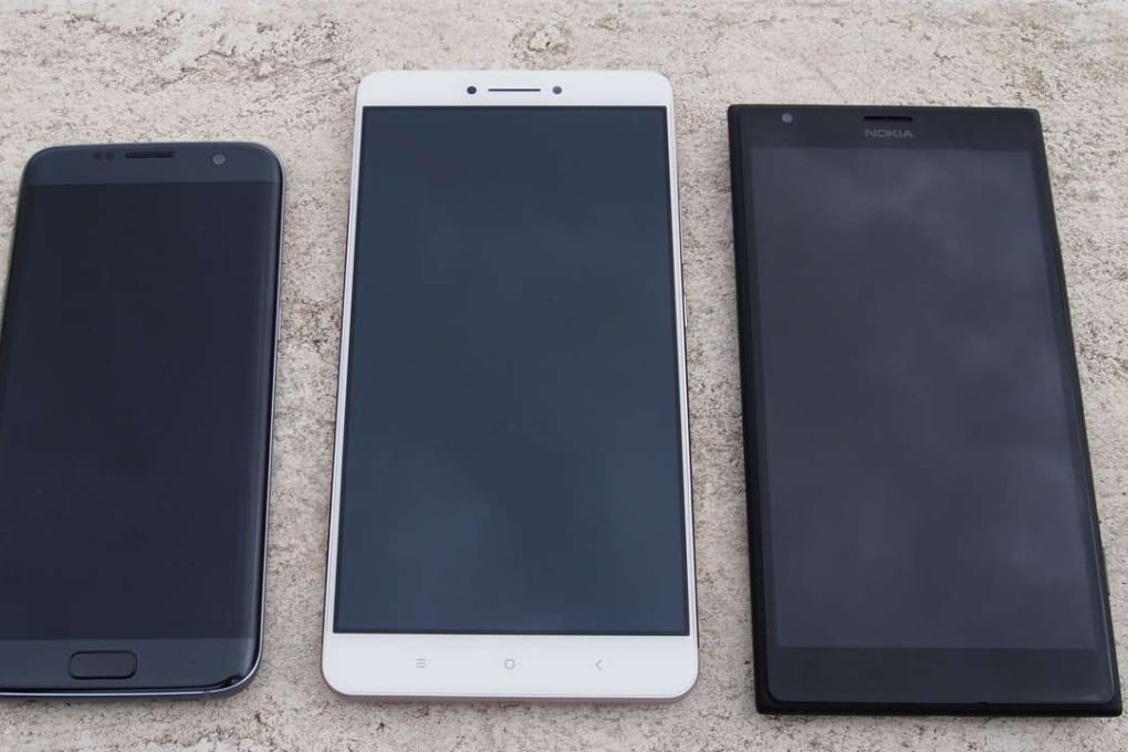 Smartphone size comparison: (from left to right) Galaxy S7 Edge, Xiaomi Mi Max and the Nokia 1520. Photo: Eric Wong
