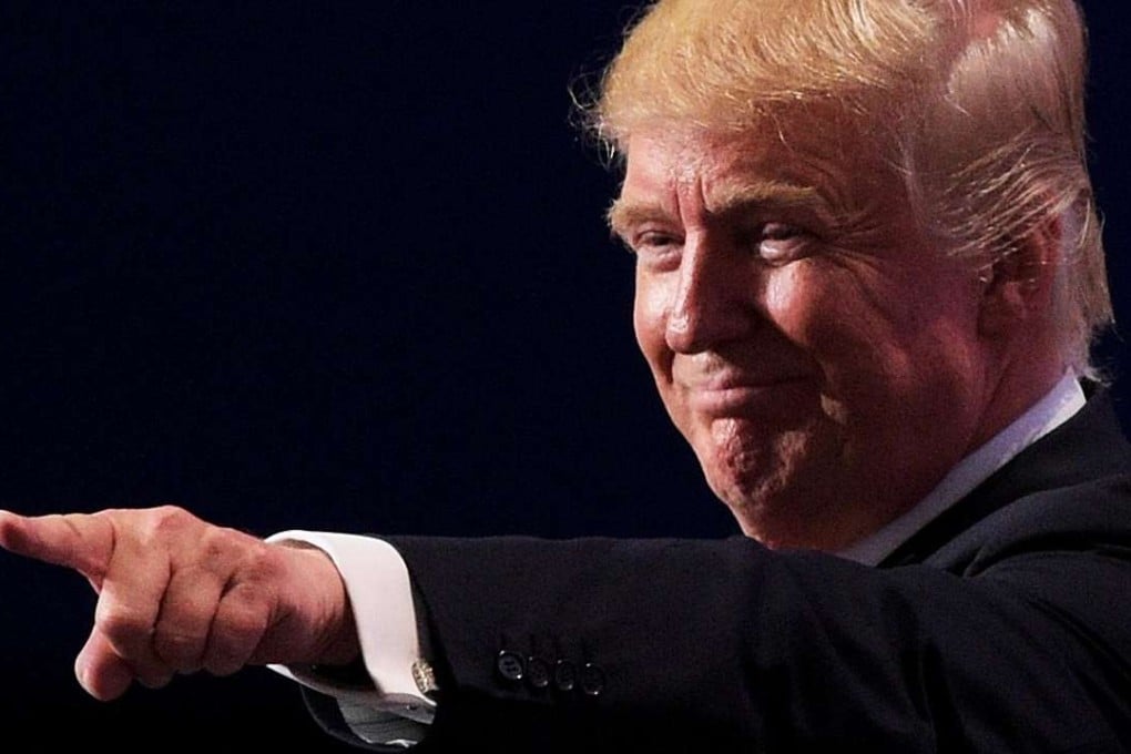 CLEVELAND, OH - JULY 21: Republican presidential candidate Donald Trump gestures at the end of the Republican National Convention on July 21, 2016 at the Quicken Loans Arena in Cleveland, Ohio. Republican presidential candidate Donald Trump received the number of votes needed to secure the party's nomination. An estimated 50,000 people are expected in Cleveland, including hundreds of protesters and members of the media. The four-day Republican National Convention kicked off on July 18. Jeff Swensen/Getty Images/AFP