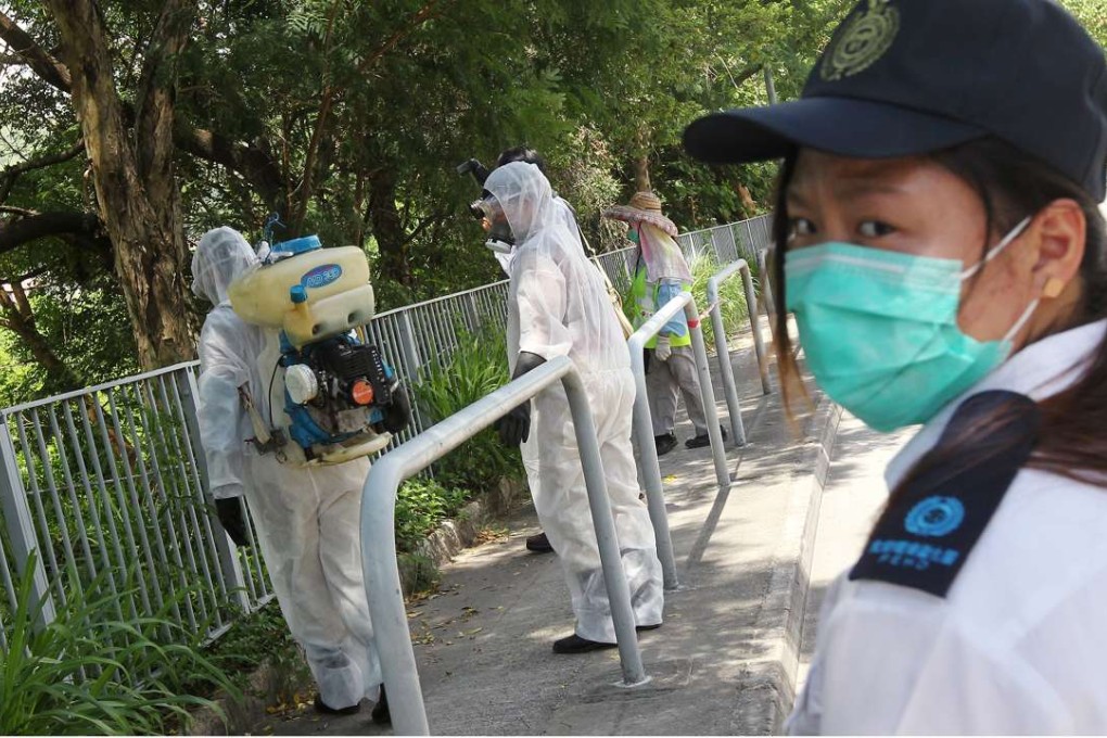 Government staff take action against mosquitoes in the New Territories in 2013. Photo: SCMP Pictures
