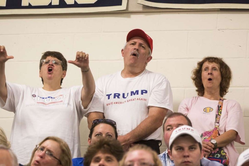 Supporters of Republican presidential candidate Donald Trump boo when Hillary Clinton is mentioned at a rally in Windham, New Hampshire. Photo: AFP