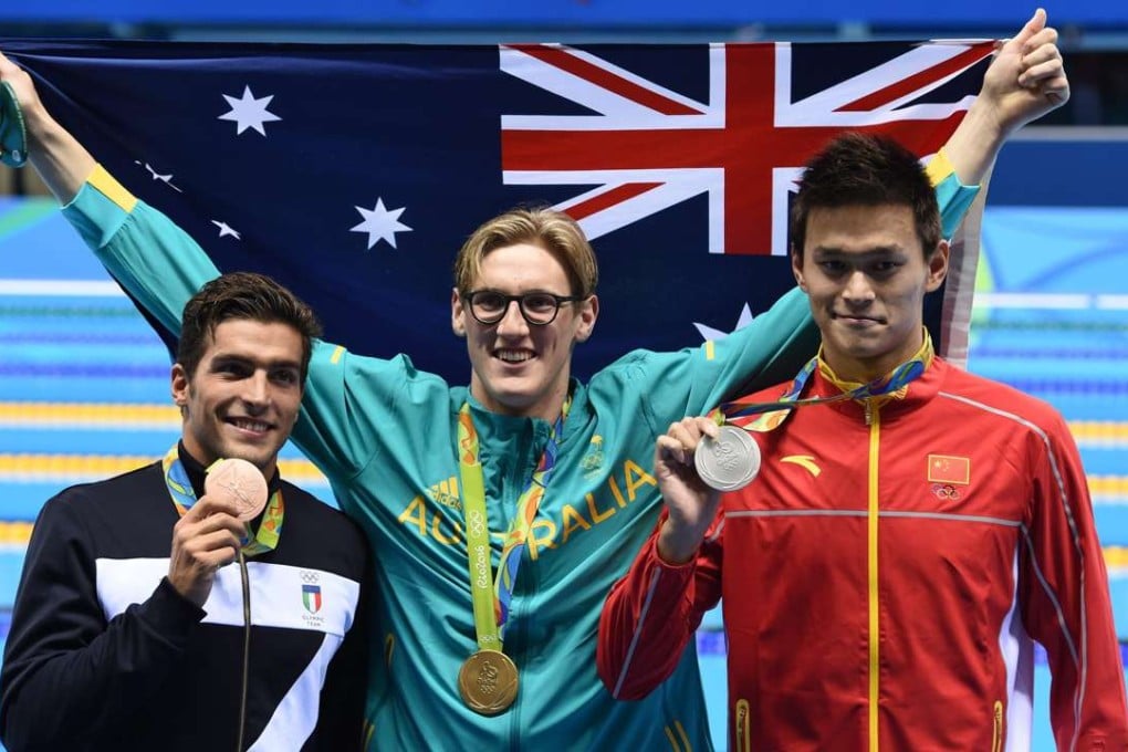 Gold medal winner Mack Horton of Australia celebrates with silver winner Sun Yang of China and Gabriele Detti of Italy. Photo: EPA