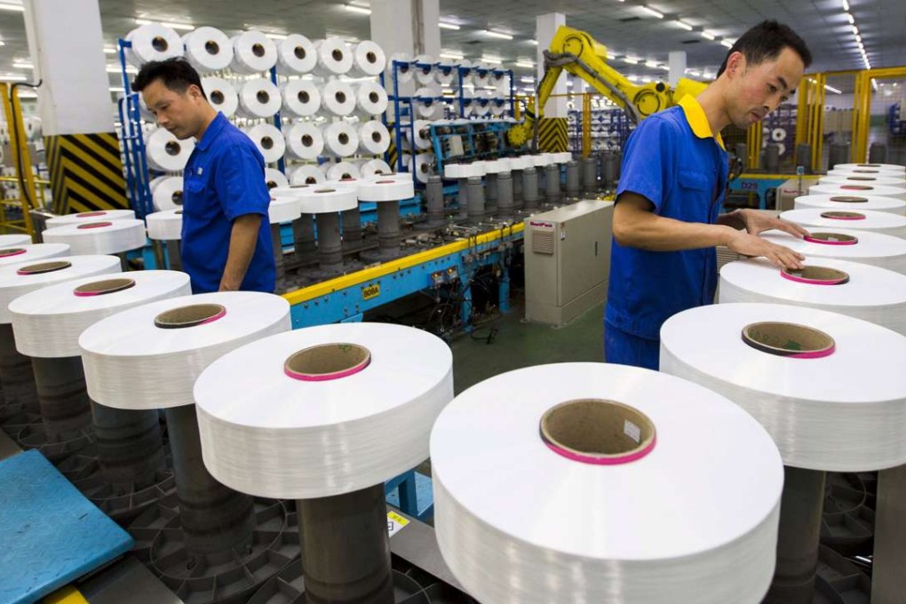 Employees work on a production line at a textile factory in Suzhou, Jiangsu province. Mainland Chinese textile exports are down 3.7 per cent in the first half of 2016. Photo: Reuters