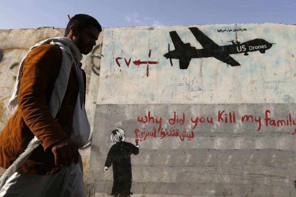A man walks past a graffiti, denouncing strikes by US drones in Yemen. The US administration has defended its use of drones as essential in fighting al-Qaeda and other militants in countries such as Pakistan, Afghanistan and Yemen. Some drone strikes have killed civilians who were not targets, igniting local anger. File photo: Reuters