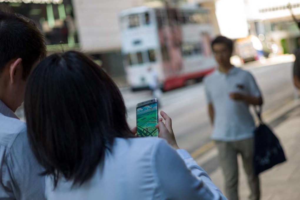 Pokémon Go players, on the first day of its release in Hong Kong on July 25. Photo: EPA