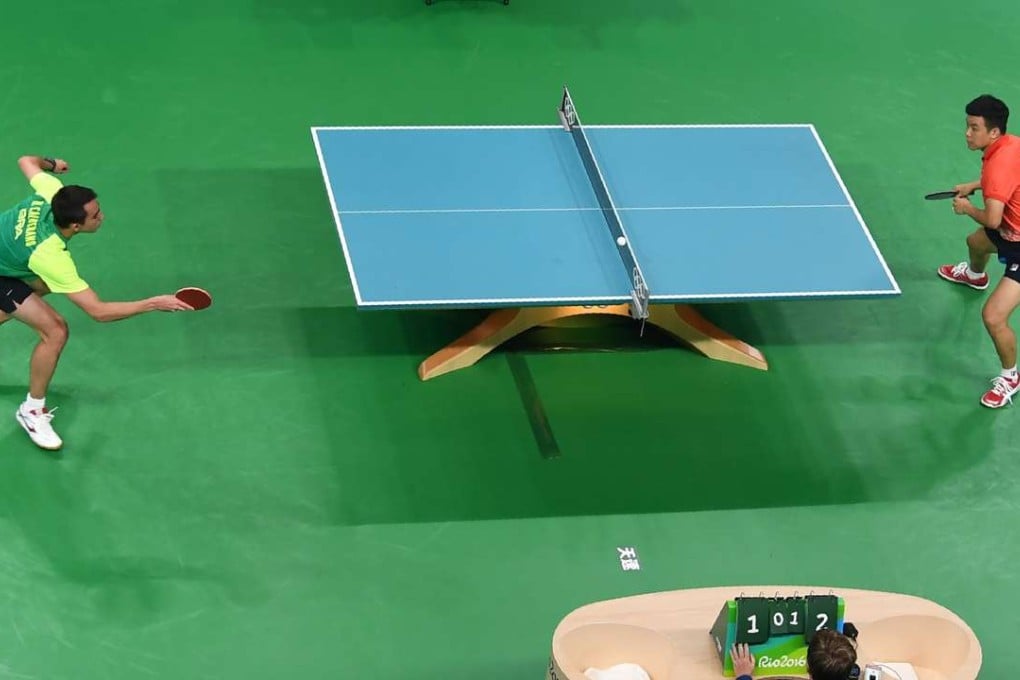 Hong Kong hope Tang Peng was eliminated at the first hurdle by Brazil's Hugo Calderano. Photo: AFP